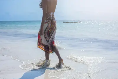 Walking the white sand at low tide