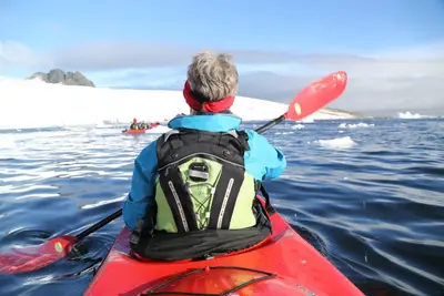 Kayaker in calm Antarctic water
