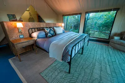 Luxury tent bed beneath the canvas