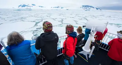 Guests on the bow watching the ice