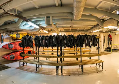 Mudroom / boot room with kayaks and expedition gear