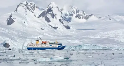 Ocean Nova beneath snow-covered peaks