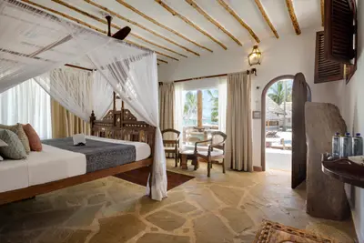 Ocean-front suite — bedroom opening to the terrace