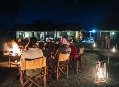 Campfire dinner under the lanterns