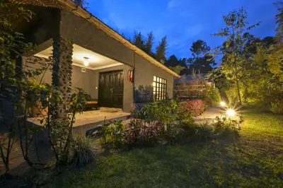 Cottage porch and garden at night