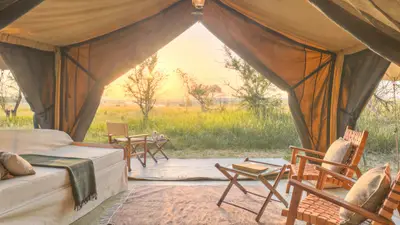 Tent opened up to the Serengeti