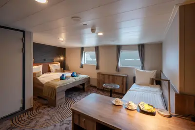 Superior cabin — double bed and sofa (21–23 m²)