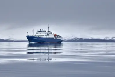 Plancius reflected in calm water, Deception Island