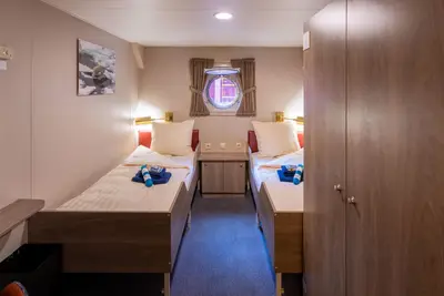 Twin Porthole cabin — two lower beds, porthole (12 m²)