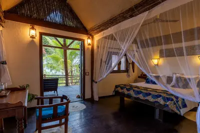 Bahari bungalow bedroom opening to the veranda