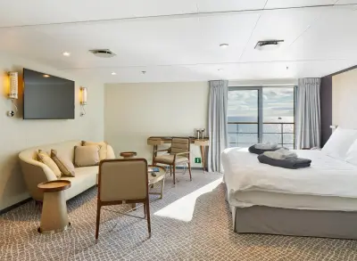 Penthouse Suite — sitting area and bed