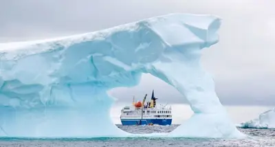 Ocean Nova framed by an iceberg arch