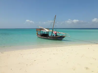 Dhow pulled up on a white-sand beach