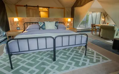 Luxury tent bedroom at golden hour
