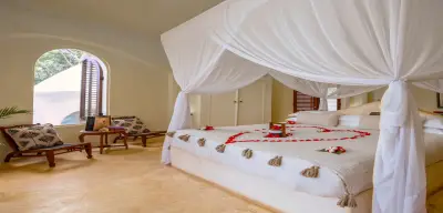 Garden View Villa bedroom open to the gardens
