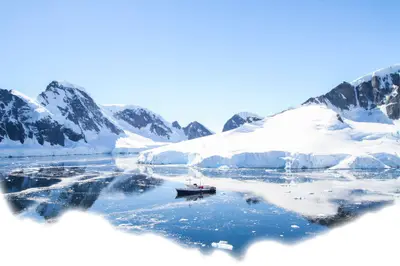 MV Ushuaia in a mirror-calm Antarctic bay