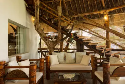 Villa lounge with driftwood staircase