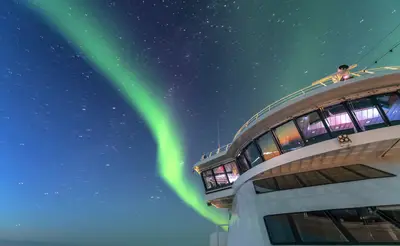 Northern lights over the bridge of MS Roald Amundsen