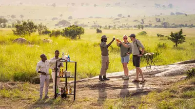 Sundowner toast on a granite kopje