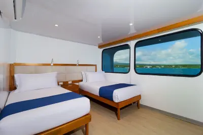 Balcony cabin — side-by-side twin beds (not for us)