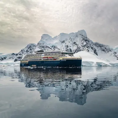 MS Roald Amundsen reflected in Paradise Bay, Antarctica