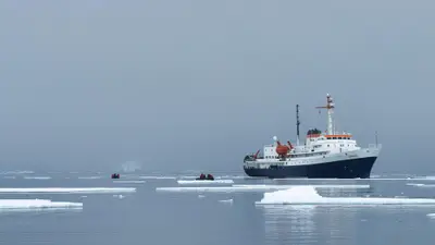 MV Ushuaia at anchor among sea ice