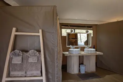 Tent bathroom — twin basins & shower