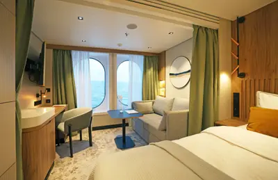 Oceanview stateroom — queen bed & sofa