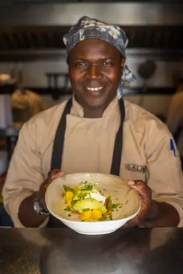 Chef presenting a seafood dish