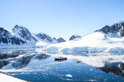 MV Ushuaia anchored in an Antarctic channel