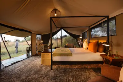 Guest tent — four-poster bed & plains view
