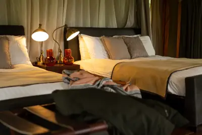 Standard tent — twin beds with bedside lamps