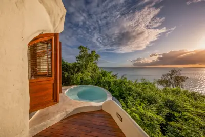 Beach villa plunge pool at sunset